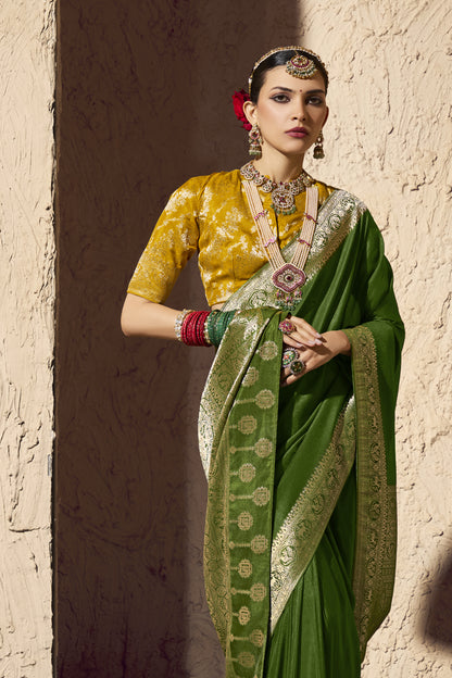 Beautiful ethnic fashion portrait of lady dressed in green Banarasi saree, traditional Indian bridal jewellery set, red roses bun hairstyle, luxury festive wear