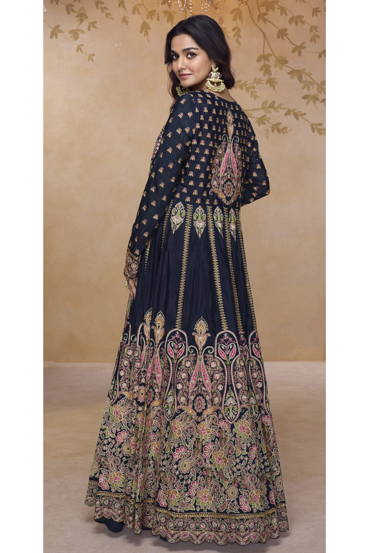 Back view of black embroidered Anarkali gown showcasing rich multicolor threadwork and intricate traditional motifs