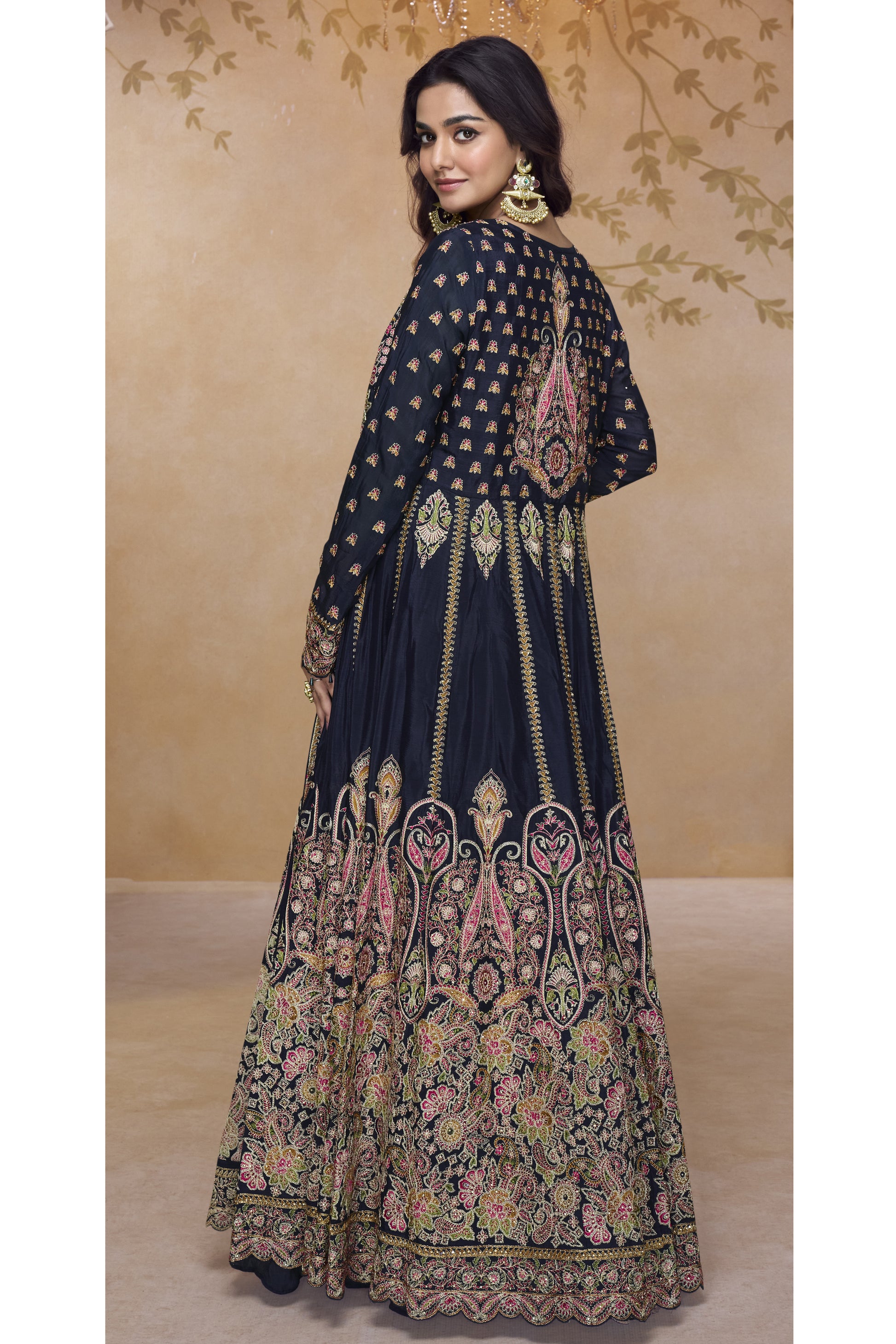 Back view of black embroidered Anarkali gown showcasing rich multicolor threadwork and intricate traditional motifs