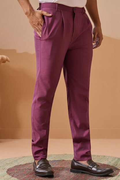 Person wearing purple pants with a desert landscape in the background
