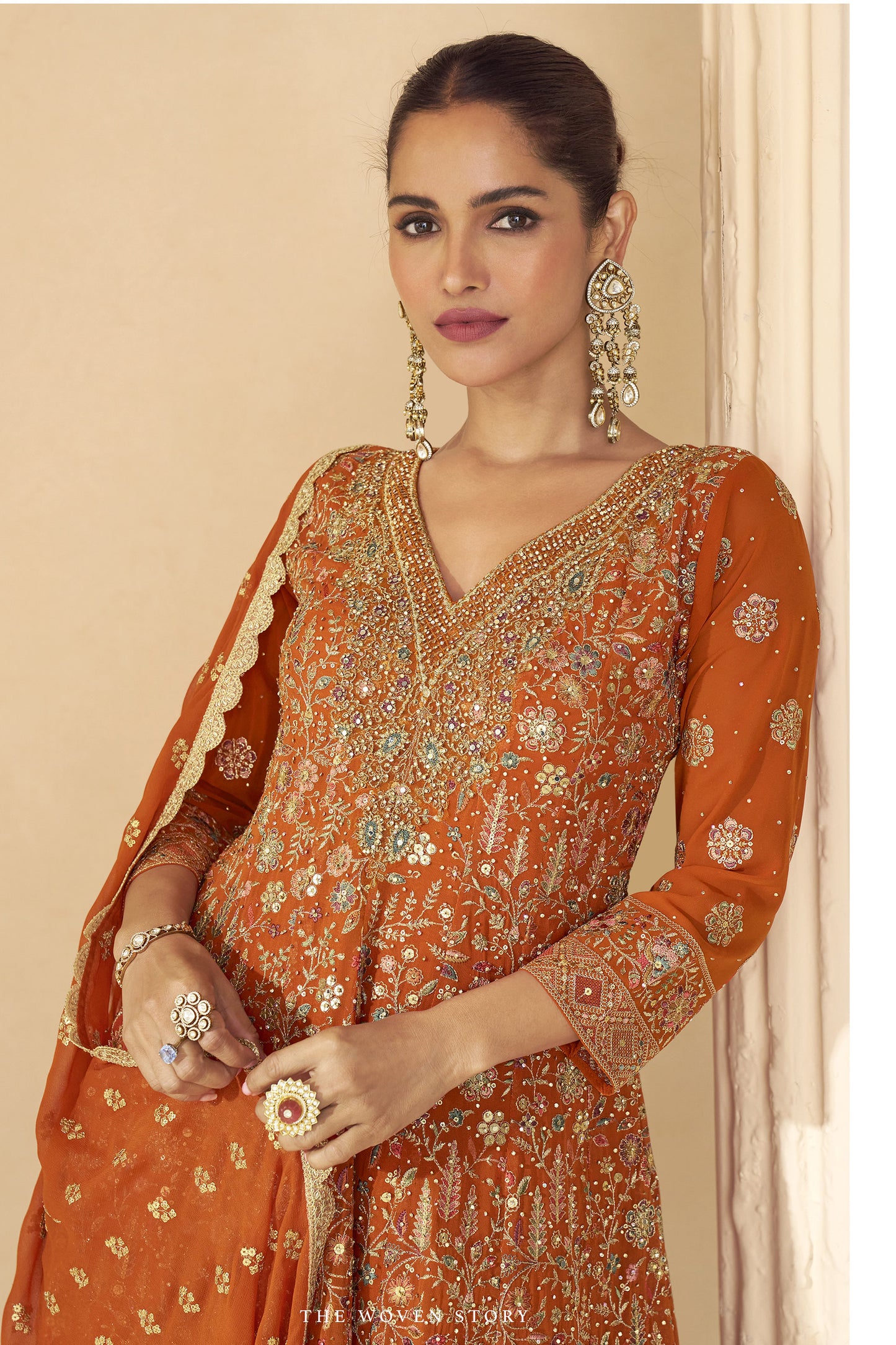 Designer festive orange sharara set with embellished dupatta and traditional detailing