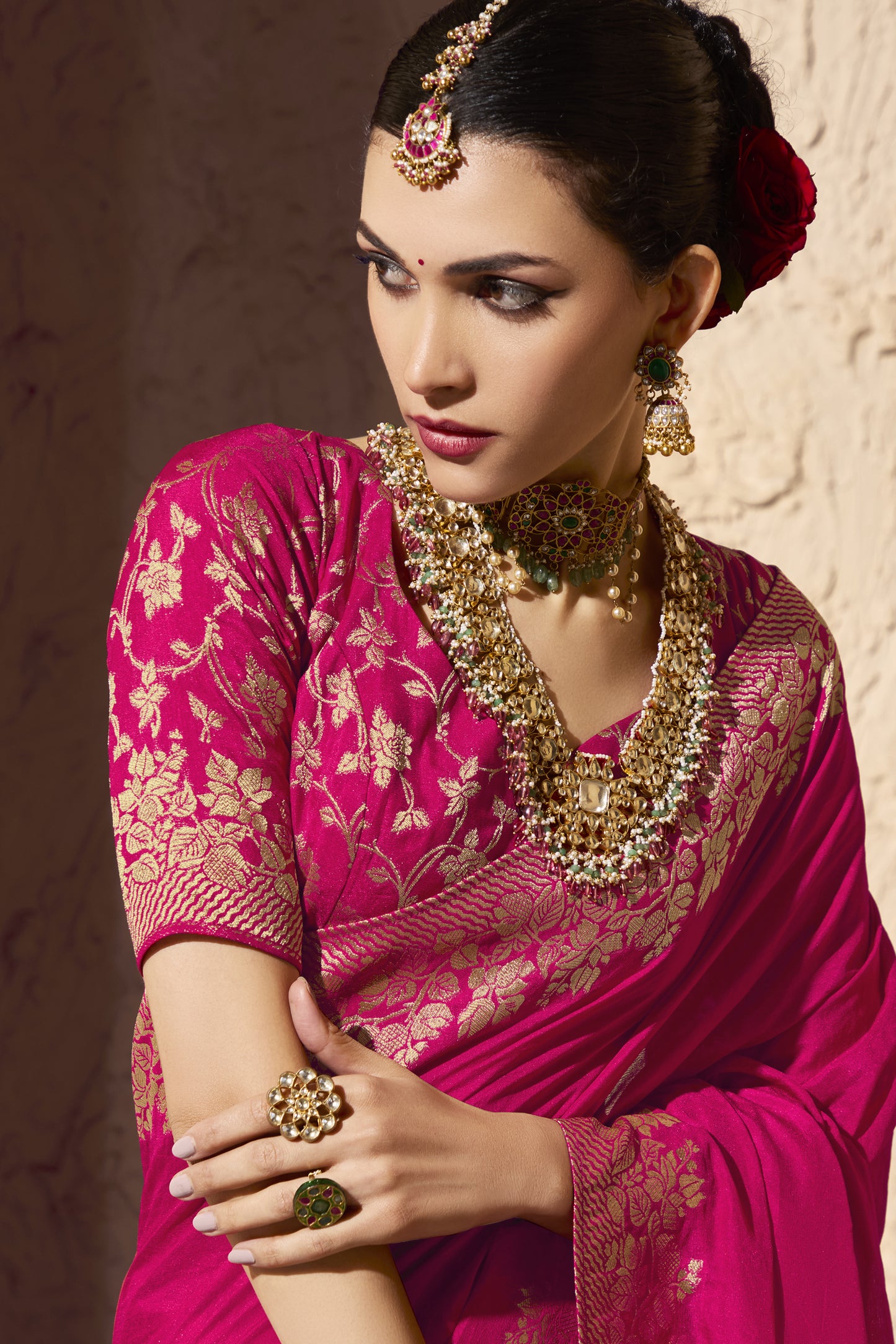 Designer backless blouse design with dori tie up and latkans on a fuchsia pink silk saree, Trending Indian saree blouse styles.