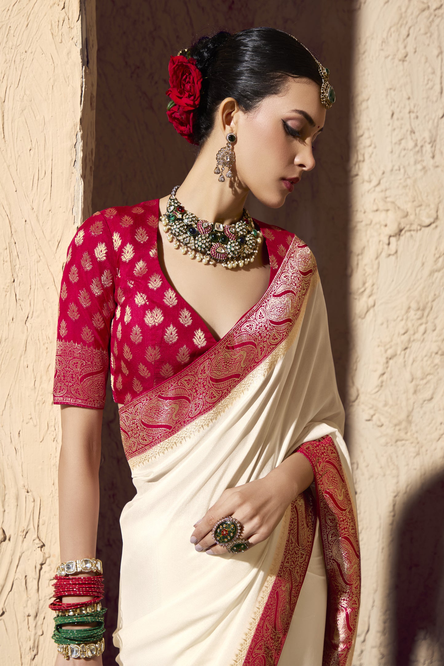 Traditional Indian silk saree in red and white with rich gold detailing, perfect for weddings.
