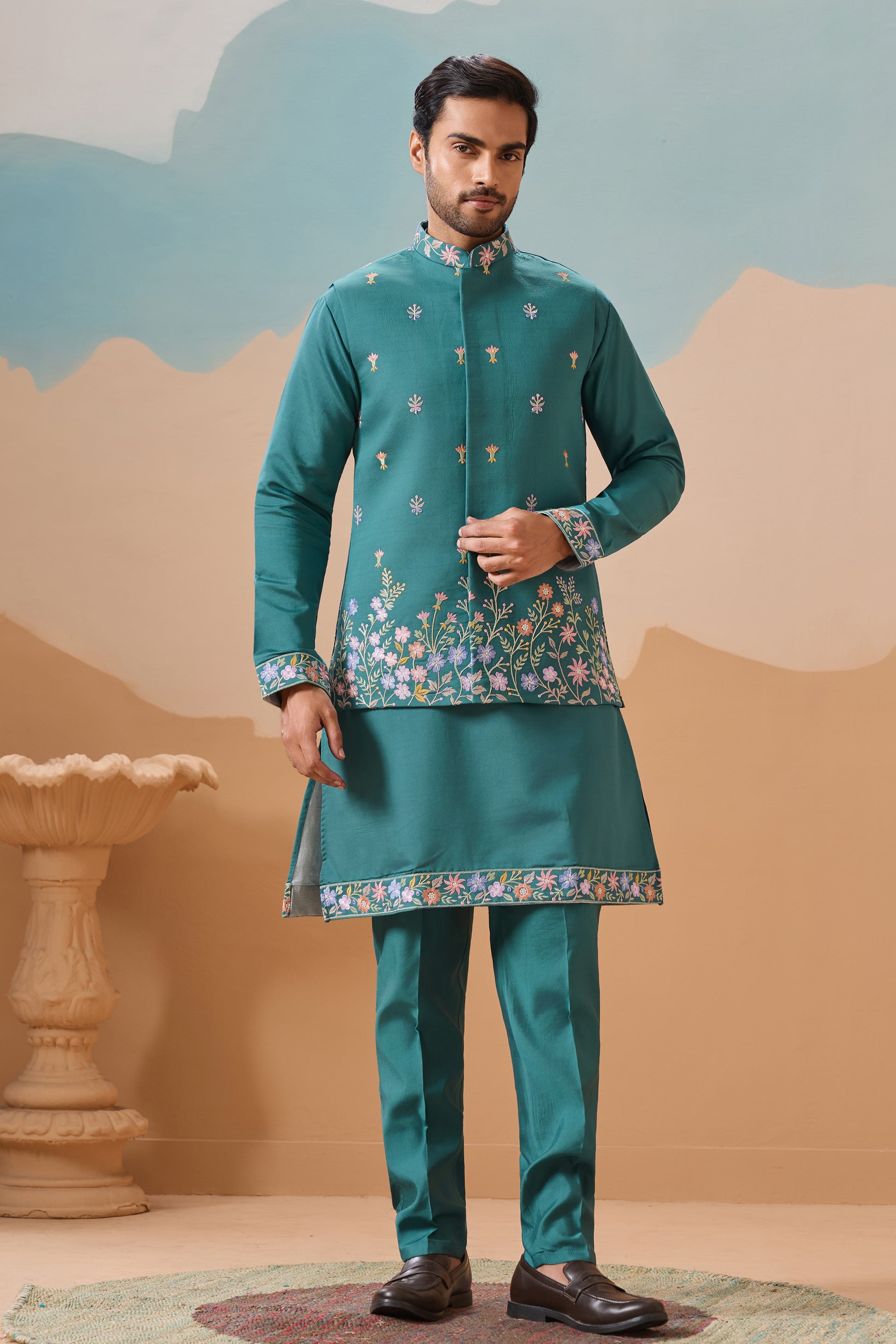 Teal kurta with koti front view with embroidered detailing

